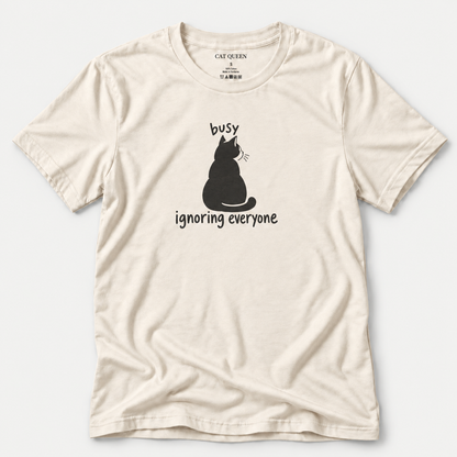 Busy Ignoring Everyone T-Shirt in Natural with black back-facing cat and text design.