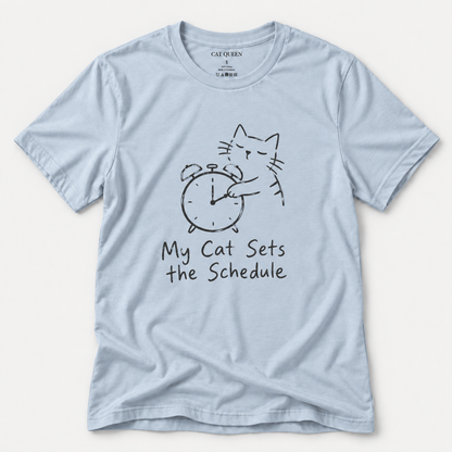 Cat Sets the Schedule T-Shirt in Light Blue with cat on an alarm clock graphic.