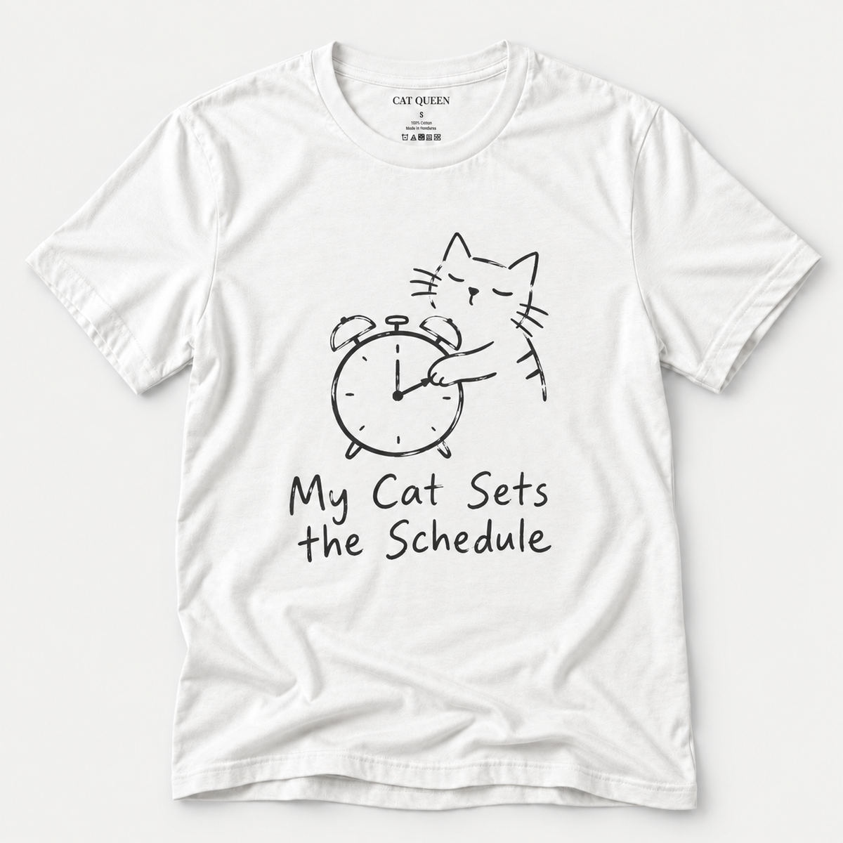 Cat Sets the Schedule T-Shirt in White with cat on an alarm clock graphic.