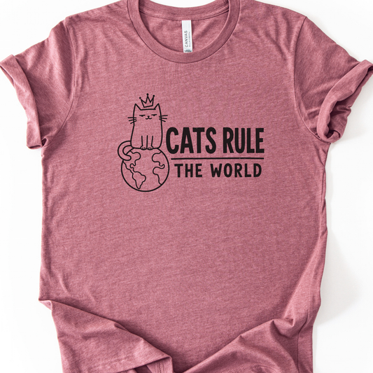 Cats Rule the World T-Shirt in Heather Mauve with black crowned cat sitting on a globe.