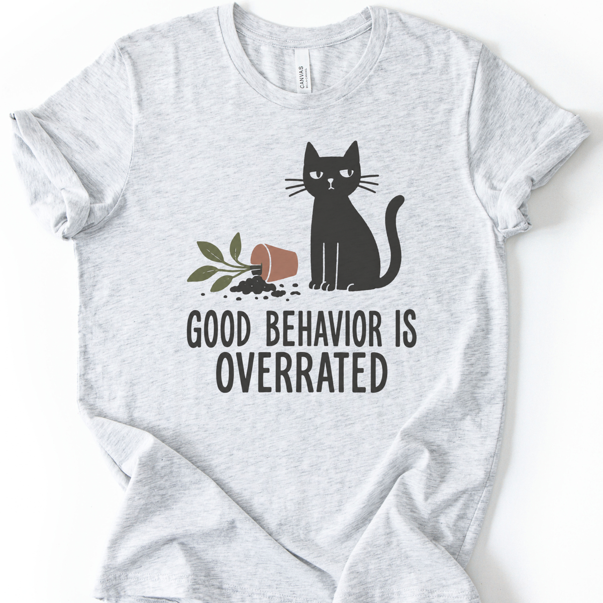 Good Behavior Cat T-Shirt in Ash with black cat and knocked-over plant graphic.