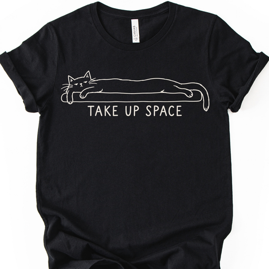 Take Up Space Cat T-Shirt in Black with long lounging cat graphic.