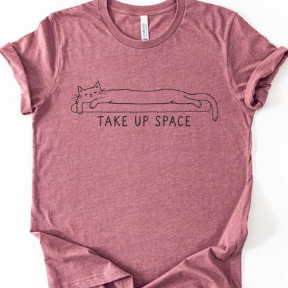 Take Up Space Cat T-Shirt in Heather Mauve with long lounging cat graphic.