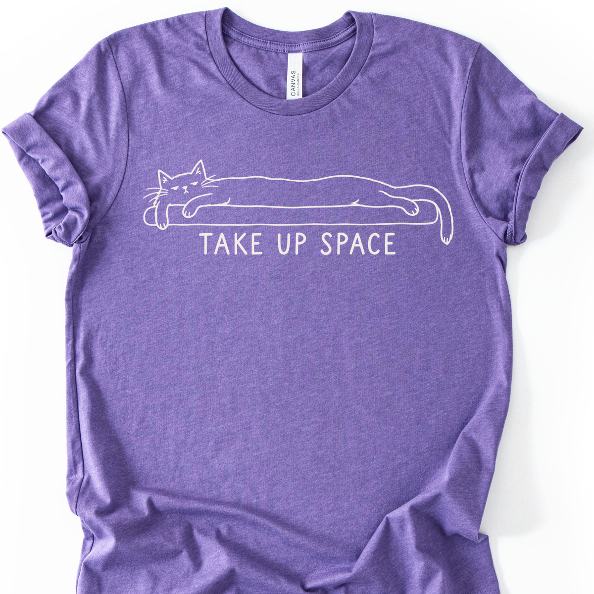Take Up Space Cat T-Shirt in Heather Team Purple with long lounging cat graphic.