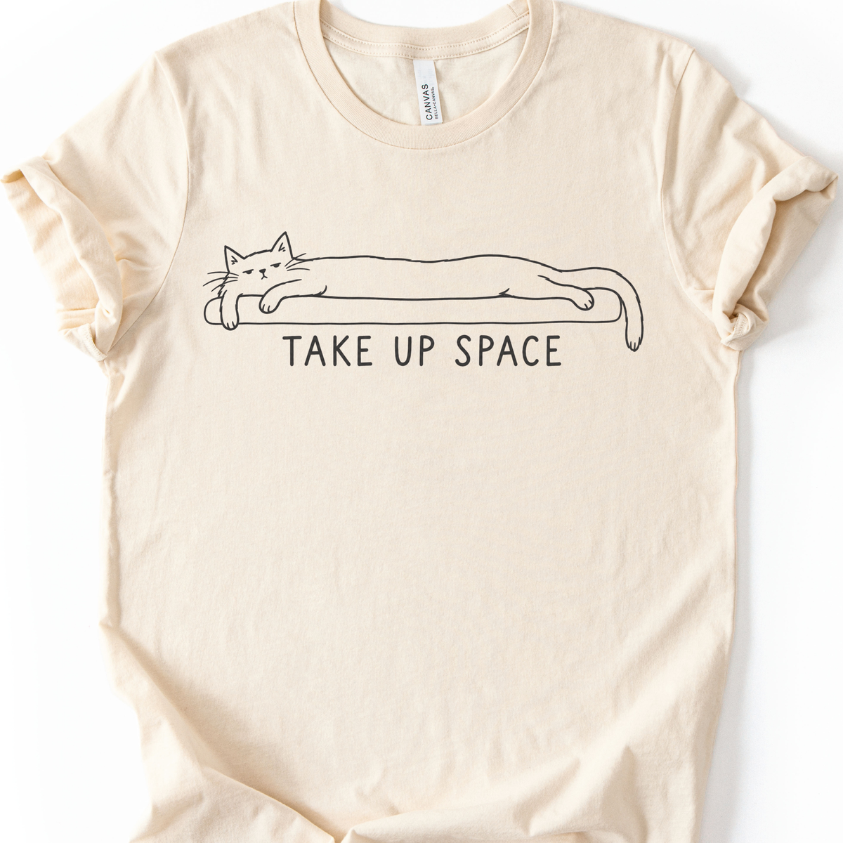 Take Up Space Cat T-Shirt in Natural with long lounging cat graphic.