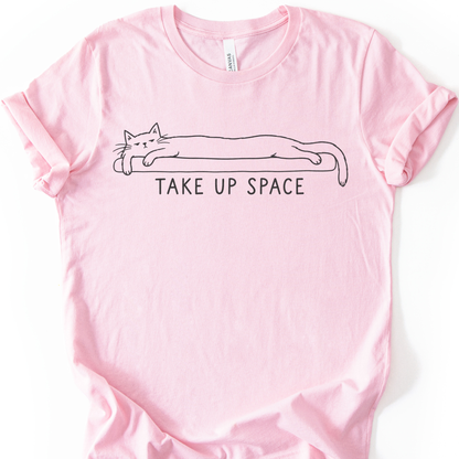 Take Up Space Cat T-Shirt in Soft Pink with long lounging cat graphic.