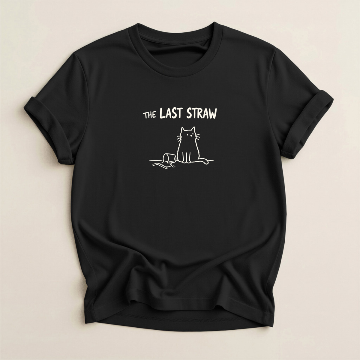 The Last Straw Cat T-Shirt in Black with off-white cat and knocked-over glass graphic.