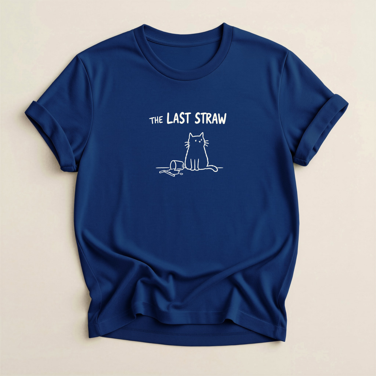 The Last Straw Cat T-Shirt in Navy with off-white cat and knocked-over glass graphic.