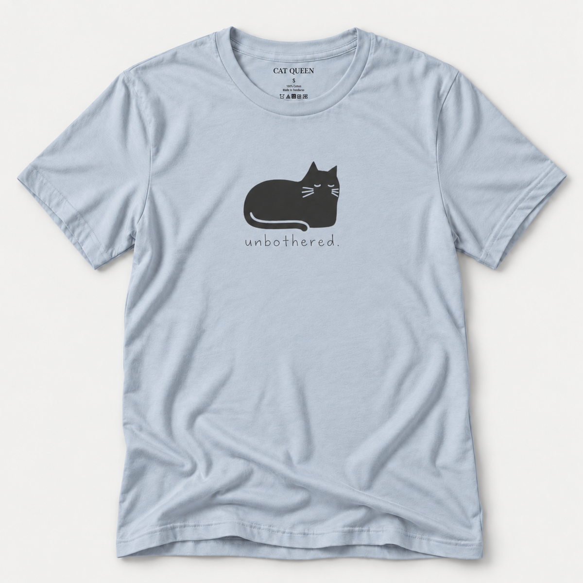 Unbothered T-Shirt in Light Blue with cat silhouette with whiskers.